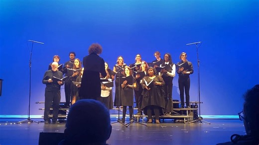 College choir singing "Walking In A Winter Wonderland" on stage risers. | Montgomery County Community College