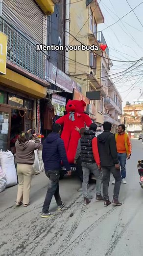 Oversized Red Teddy Bear in Urban Adventures