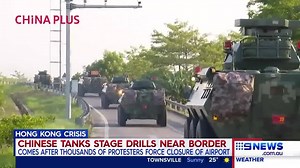 Chinese tanks have been spotted undergoing drills close to the Hong Kong border, after the city’s airport was forced to close due to escalating protest action. Have you been stranded by the closure? Contact us: m.me/9News #9News | https://9News.com.au | 9 News