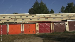 Old metal garage doors.The aged gates of old garages. Old worn abandoned garages.