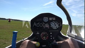 Cockpit point of view POV footage in modern glider sailplane waiting for takeoff guys preparing tow cables showing also gauges for reading altitude airspeed ascending speed beautiful day blue sky 4k