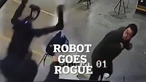 Chilling moment humanoid robot wakes up and starts attacking its handlers while trying to break free from restraints