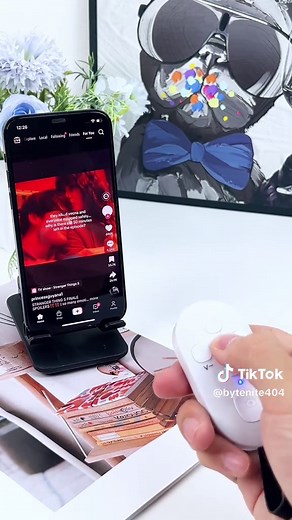 How can I scroll through TikTok without touching the screen?#tiktokmademebuyit #coolgadgets #remotecontrol #tiktokgadgets #gadget