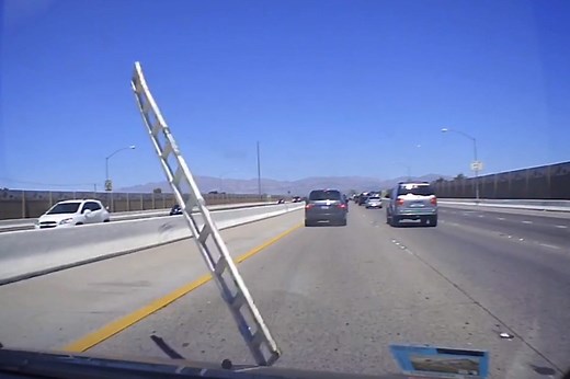 Flying ladder crashes into driver’s windshield