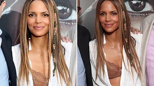 Halle Berry accidentally flashes her bra as her shirt falls open on the red carpet at Kidnap premiere in Los Angeles