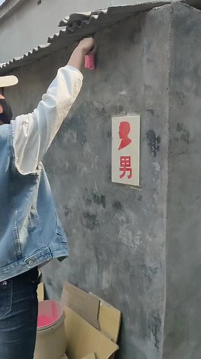 Applying Pink Paint on Rustic Wall