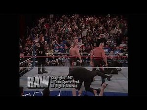 Nation of Domination jump Undertaker. Legion of Doom make the save! 1997 (WWF)