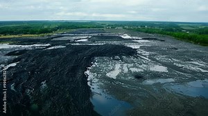 Aerial view of damaged peat bog shows environmental impact of extraction, highlighting need for conservation and sustainable practices