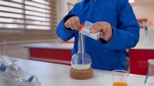 ‏Today in grade 4A , we learned about the liquid state. We did an experiment with water، milk and juice .We noticed that liquid does not have a fixed shape . The liquid changes its shape depending on the container we put it in. For example, when we pour water into a cup or a bottle, it takes the shape of that container. This experiment helped us understand the properties of liquids.” | Academy Schools - مدارس الأكاديمية