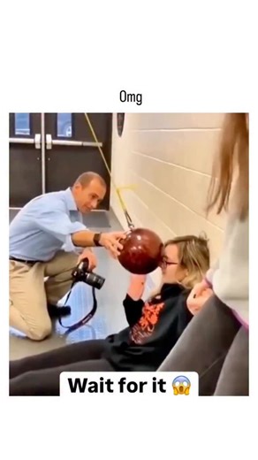 trendpluse_offical on Instagram: "The post features a viral video clip of a failed physics demonstration where a man sitting against a wall pushes a suspended bowling ball pendulum toward himself, causing it to rebound and strike him unexpectedly, captioned "Omg " for comedic effect. This illustrates conservation of mechanical energy in pendulums: without interference, the ball halts just before impact due to string tension dissipating energy, but the added push increases kinetic energy, resulti