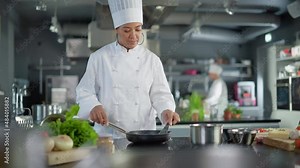 Restaurant Kitchen: Portrait of Black Female Chef in Action, Uses Pan to Cook Delicious, Traditional Authentic Food, Looks at Camera and Smiles. Healthy gourmet Dishes. Medium Wide Shot