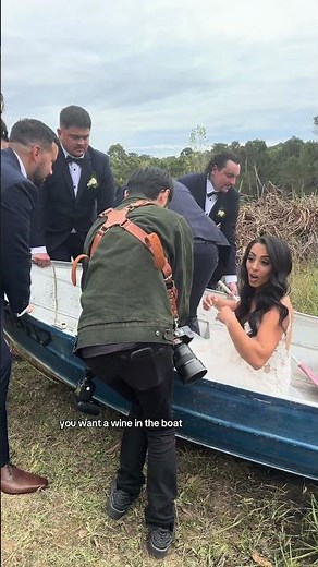 Bride risks getting her wedding dress dirty to get the perfect shot!