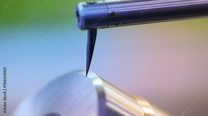 metal gear lead profile testing process. close up of stylus probe checking a metal component. latest hi tech machinery of forging and machining industry. quality control process measuring accuracy