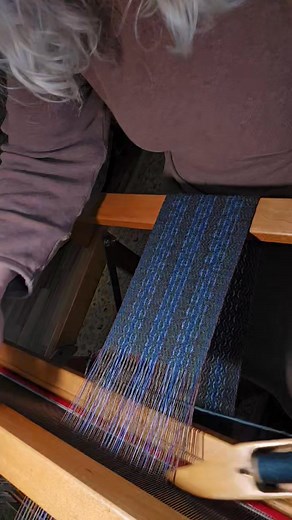 Update: This sash is sold! A sash with a linen warp in green, brown, and shades of blue, and a wool weft in loden blue. When it's finished, it will be about 12 feet long and 5 inches wide, with several inches of twisted fringe at each end. It'll be added to my inventory, so it's available for now. Thanks for looking! | Once Upon A Loom