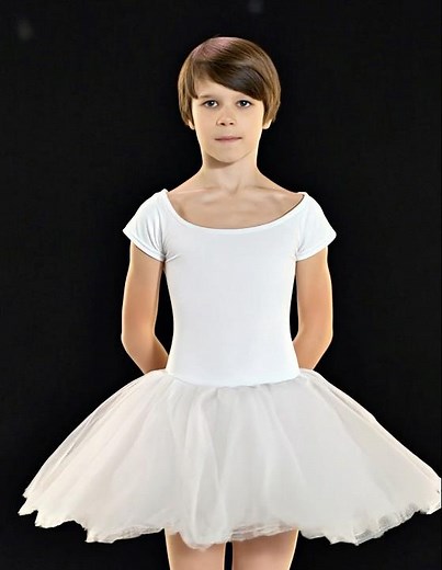 A boy in a ballet tutu dancing silly