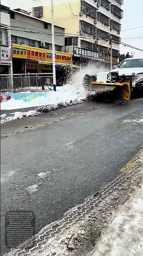 Snow Plow in Action: Navigating Slippery Roads