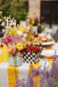 Summer entertaining, the MacKenzie-Childs way - a mix of floral patterns, classic checks, and a colorful spread! Shop here: cur.lt/yoi8suc1d 🥂 | MacKenzie-Childs