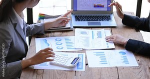 4k video footage of a group of young Business people discuss investment project working on Statistical analysis and accounting of annual financial data of enterprises