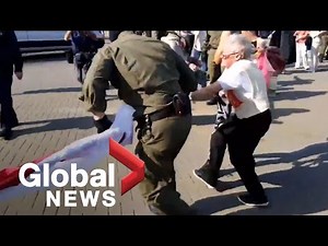 Belarus protests: Police wrestle flag from elderly demonstrator during ongoing protests