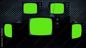 An exhibition of old-fashioned retro color tv sets with tuner antennas.