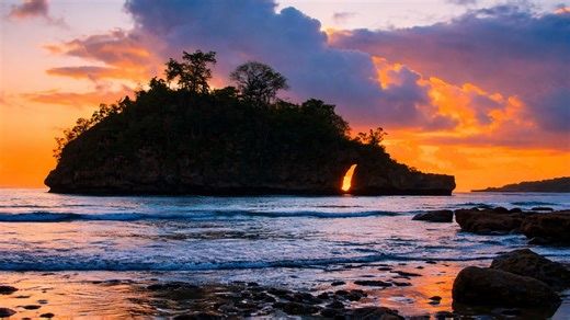 Evening light shining through a natural rock arch