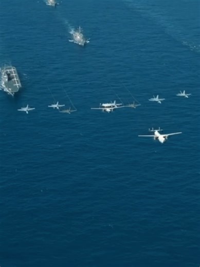 Welcome to the Military Macarena - Part 2 U.S. Navy carrier strike group operations demonstrate integrated maritime power projection, with Ford-class or Nimitz-class aircraft carriers serving as mobile airbases for aviation assets like the F/A-18 Super Hornet (twin-engine multirole fighter with AESA radar for air superiority and precision strikes), F-35C Lightning II (stealth fifth-generation jet with sensor fusion for network-centric warfare), and EA-18G Growler (electronic attack variant of th