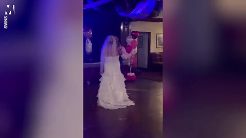 Newlyweds surprised guests with baby gender reveal during wedding dance