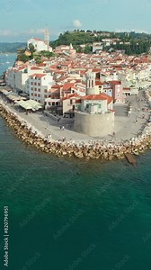 Aerial view of the Piran old town with an old lighthouse, St. George's Parish Church and historic buildings, Slovenia. Picturesque historic town Piran on the Mediterranean coast in Slovenia.