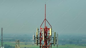 A cell site tower is a tall metal structure that houses electronic equipment and antennas, It plays a critical role in providing cellular coverage and connectivity to mobile devices in its range. Stock Video