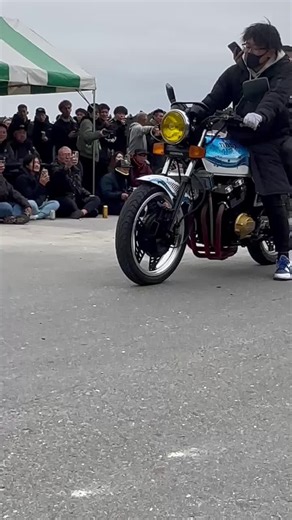Classic Motorcycle Stunt Performance in Outdoor Setting