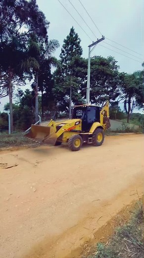 CAT Backhoe Loader in Tropical Setting