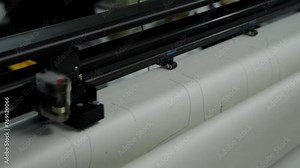 Printer Crafting Patterns on Large Paper Roll. Printer precisely cuts pattern outlines on paper. Concept Pattern Production