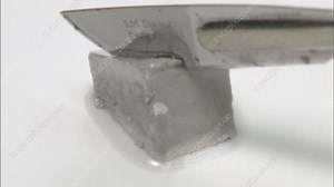 Cutting sodium metal - Stock Video Clip - K001/3545