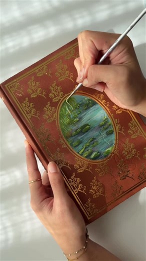 Kan on Instagram: "Hey booksta fam, just popping in to let you know that there’s a full step by step guide to painting book covers in my craft book which you can pre-order now (linked it in my bio) xo Love the dreamy vibes this Wind in the Willows painting is giving ✨ #bookpainting #bookcover #bookreels #painting #bookstagrammer"