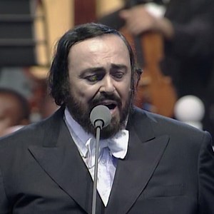 Pavarotti & Eric Clapton perform Holy Mother at the War Child concert for the aid of Children in Bosnia on the 20th June, 1996. | Luciano Pavarotti