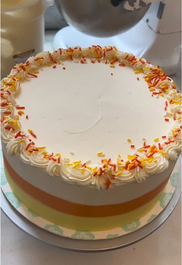 October is here and so is our Candy Corn Cake! 🎃🍰 Celebrate spooky season with our classic vanilla confetti cake, packed with orange yellow sprinkles, and decorated like everyone’s favorite Halloween candy. Available for advance order pick-up at the link in our bio! #magnoliabakery #cakeicing #candycorncake #spookytreats #halloweendesserts #candycorn #halloween #cakedecorating