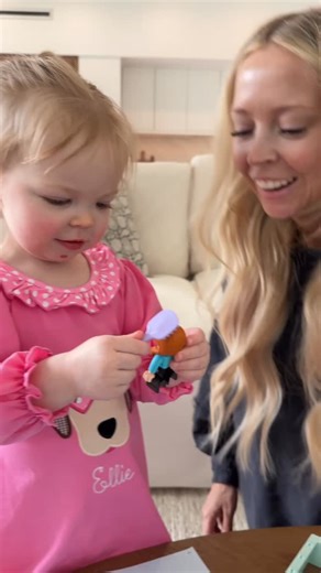 Kay and Tay Dudley on Instagram: "I didn’t expect Ellie to say that at the end! 😅 backstory ::: Kay and I have been slowly giving Ellie her presents from Christmas so that she has time to enjoy each one. We brought out this one today and were so excited to see how she would react, so we waited until after her nap and then brought her into the living room to see it! If you notice that Kay is a little tan, it’s because she had a spray tan just before and hadn’t showered it off yet. Ellie loved he