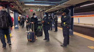 First responders on the scene after a man was pushed onto the subway tracks in Mnahattan