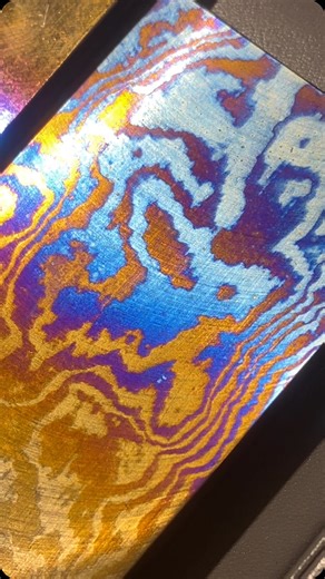 Tim Mosso: Luxury Watch Videos on Instagram: "Let’s finish our Watches and Wonders 2025 coverage firing “Damascus” style folded titanium at Genus. Folding the metal creates layers that become visible when the billets of grade 5 titanium are fired. Every color in the spectrum between blue and yellow can be expressed. A Genus watch case is crafted from solid billet when titanium is selected. #genus #genuswatches #genuswatch #watchesandwonders #titaniumwatch #damascussteel #titanium #metalcraft"