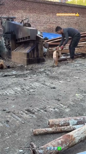 Old massive machining shredding metal scraps at junk yard
