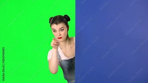 Woman looking out from behind blue blank placard and calls to herself pointing finge