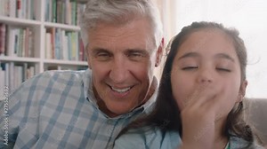grandfather and child having video chat little girl sharing vacation weekend with family grandpa enjoying chatting on mobile technology at home with granddaughter pov 4k
