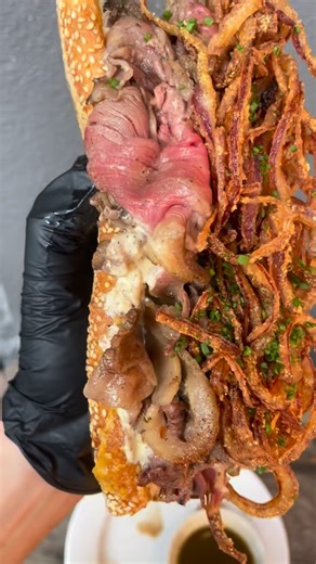 Dimo’s Italian Specialties on Instagram: "The weather makes me feel like Taking a dip. Come dive off the deep end in to this FRENCH DIP. RARE ROASTED STRIPLOIN. REDWINE CARAMELIZED ONIONS. CHEDDAR. HORSERADISH DIJONAISSE. FRIED ONIONS. AUJUS #italian #frenchdip #pdx #travelportland #italiandeli #deli #market #bar #portlandoregon #sandwiches #cocktails"