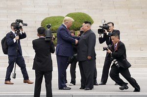 Wide grins and historic handshake for Trump, Kim at DMZ