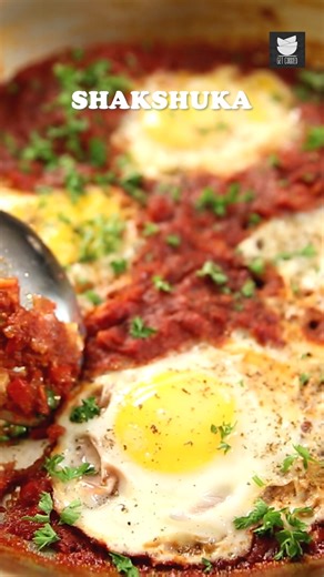 Dive into this stunning Shakshuka Recipe by The Bombay Chef – Varun Inamdar! Poached eggs simmered in a rich, spicy tomato and pepper sauce. It's warm, comforting, and packed with flavor. Host: Varun Inamdar Ingredients: 1 tbsp oil 1 medium onion chopped 1 clove garlic, minced 1 medium red bell pepper, chopped 3 cups tomatoes (puree) 2 tsp chilli powder 1 tsp cumin powder 1 tsp sugar 1/2 tsp mixed herbs Salt to taste 5-6 nos eggs Crushed pepper as required 1/2 tbsp fresh chopped parsley (optiona