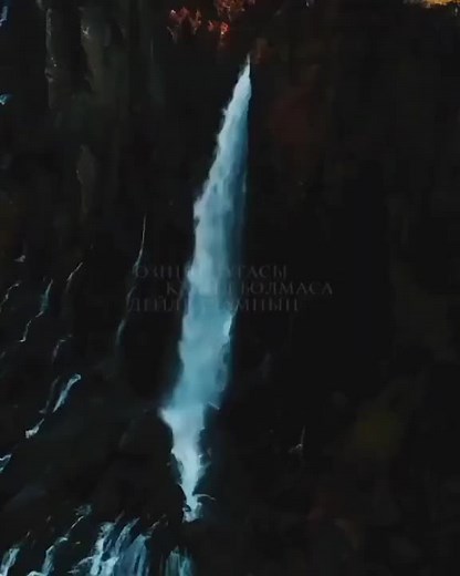 Stunning Aerial Views of a Serene Waterfall