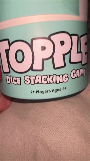 Have you heard about the dice stacking game that’s taking over TikTok This is topple a dice stacking game from the fantastic factor. The goal is to stack as many dice as you can before they topple over you can score bonus points for specific combinations like lines of three a large one and a small one it’s super fun and addictive game that’s perfect for game night and family gatherings Get your game on and try topple today!
