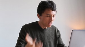 Premium stock video - Eurasian man angry at the computer when participating to an online meeting