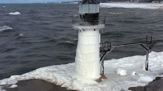 Waves Slam Frozen Lighthouse on Lake Michigan Ahead of Arctic Blast