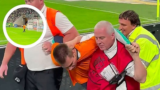Climate protester storms soccer field in the middle of match in Poland